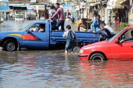 Vehicles drive through a flooded street following heavy rain in Alexandria , Egypt, 25 October 2015. According to media reports, Egypt's Health Ministry has announced the death of seven people in the Mediterranean city of Alexandria on 25 October due to the bad weather. The ministry said in a statement that six people were killed when an electric cable fall on them due to the strong winds in Moharam Bek district near the tram. EPA/MAHMOUD TAHA/MASRY ALYOUM EGYPT OUT