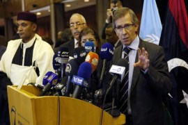 United Nations envoy for Libya Bernardino Leon, right, gestures as he makes an announcement to the media in Skhirat, Morocco, Thursday, Oct. 8, 2015. The U.N. envoy for Libya has proposed a national unity government for Libya after months of difficult talks between the north African country's two rival governments, but now it's up to the two sides and Libyans themselves to approve it. (AP Photo/Abdeljalil Bounhar)