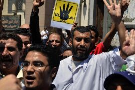 Egyptians supporting ousted president Morsi hold their hands up in a sign of the number four as they take part in a gathering called for by the Muslim brotherhood near Abassiya in Cairo, Egypt, 23 August 2013. The four is a reference to the mosque near the bigger sit-in location named Rabaa Adawaiya, Rabaa being the name of a saint but it also meaning 'four' in Arabic. Supporters of ousted president Mohamed Morsi were planning marches nationwide in what they called the 'Friday of Martyrs' following the weekly noon prayers, a day after toppled president Hosny Mubarak was released from prison and placed under house arrest.