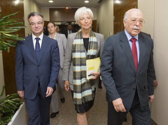 International Monetary Fund (IMF) Managing Director Christine Lagarde (C) meets with Tunisia's Central Bank Governor Chadli Ayari (R) and Tunisia's Finance Minister Slim Chaker (L) at the Central Bank of Tunisia in Tunis, Tunisia September 8, 2015. REUTERS/Stephen Jaffe/IMF Staff/Handout via Reuters ATTENTION EDITORS - THIS PICTURE WAS PROVIDED BY A THIRD PARTY. REUTERS IS UNABLE TO INDEPENDENTLY VERIFY THE AUTHENTICITY, CONTENT, LOCATION OR DATE OF THIS IMAGE. FOR EDITORIAL USE ONLY. NOT FOR SALE FOR MARKETING OR ADVERTISING CAMPAIGNS. THIS PICTURE IS DISTRIBUTED EXACTLY AS RECEIVED BY REUTERS, AS A SERVICE TO CLIENTS.