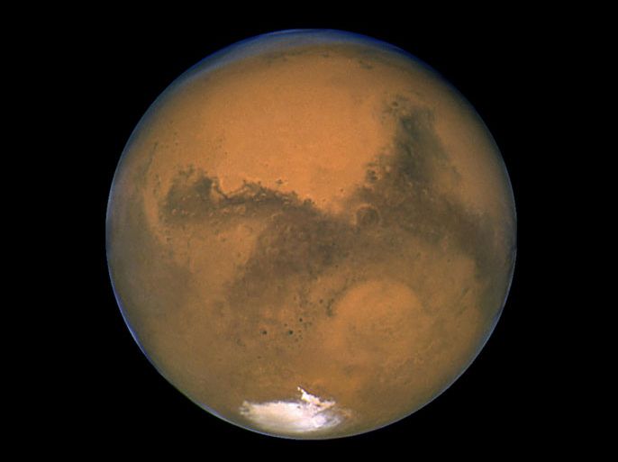 The planet Mars is seen in an image from NASA's Hubble Space Telescope taken August 27, 2003. Scientists have found the first evidence that briny water may flow on the surface of Mars during the planet's summer months, a paper published on Monday showed. REUTERS/NASA/Handout via Reuters THIS IMAGE HAS BEEN SUPPLIED BY A THIRD PARTY. IT IS DISTRIBUTED, EXACTLY AS RECEIVED BY REUTERS, AS A SERVICE TO CLIENTS. FOR EDITORIAL USE ONLY. NOT FOR SALE FOR MARKETING OR ADVERTISING CAMPAIGNS