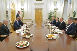 YK3069 - Moscow, -, RUSSIAN FEDERATION : Syrian President Bashar al-Assad (2nd-L) attends a lunch meeting with Russian President Vladimir Putin (2nd-R), Russian Prime Minister Dmitry Medvedev (3rd-R), Russian Foreign Minister Sergei Lavrov, Russia's Foreign Intelligence Chief Mikhail Fradkov (3rd-L), Security Council secretary Nikolai Patrushev (4th-L, standing) and Russian Defence Minister Sergei Shoigu (R) at the Kremlin in Moscow on October 21, 2015. Assad, on his first foreign visit since Syria's war broke out, told his main backer and counterpart Putin in Moscow that Russia's campaign in Syria has helped contain "terrorism". AFP PHOTO / RIA NOVOSTI / KREMLIN POOL / ALEXEY DRUZHININ