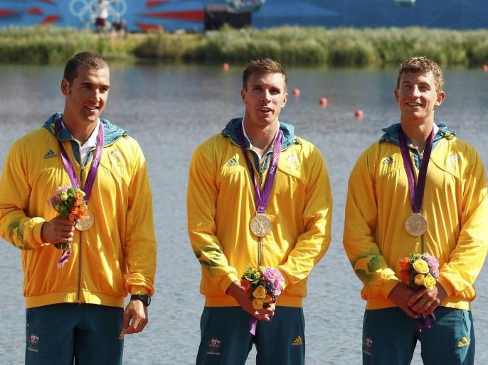 Australia's Tate Smith (L), David Smith (2nd L), Murray Stewart and Jacob Clear (R) stand with their medals during the victory ceremony for the men's kayak four (K4) 1000m event at Eton Dorney during the London 2012 Olympics Games August 9, 2012. They won the gold. REUTERS/Darren Whiteside (BRITAIN - Tags: SPORT CANOEING OLYMPICS TPX IMAGES OF THE DAY)