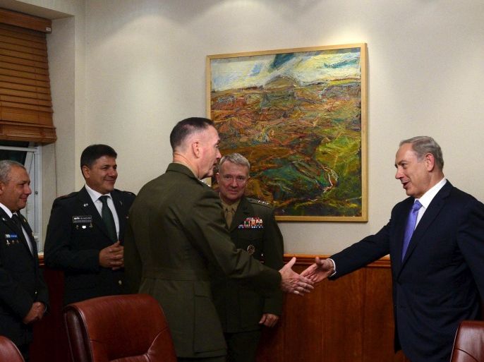 Israel's Prime Minister Benjamin Netanyahu (R) shakes hands with U.S. Chairman of the Joint Chiefs of Staff Joseph Dunford during a meeting in Jerusalem in this October 18, 2015 handout photo by Israel's Government Press Office. REUTERS/Israel's Government Press Office/Handout via ReutersATTENTION EDITORS - THIS PICTURE WAS PROVIDED BY A THIRD PARTY. THIS PICTURE IS DISTRIBUTED EXACTLY AS RECEIVED BY REUTERS, AS A SERVICE TO CLIENTS. EDITORIAL USE ONLY. NOT FOR SALE FOR MARKETING OR ADVERTISING CAMPAIGNS. ISRAEL OUT. NO COMMERCIAL OR EDITORIAL SALES IN ISRAEL.