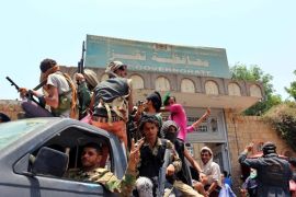 Tribal fighters from the popular resistance patrol outside the headquarters of Taiz Governorate following heavy clashes witht eh hotuhis and their allies in Taiz, Yemen, 15 August 2015. According to reports, tribal forces have captured much of Taiz, in central Yemen, after fierce clashes with Houthi fighters and forces loyal to ex-president Ali Abdullah Saleh. Following airstrikes and ground operations carried out by a Saudi led coalition forces opposing the Houthis have manged to capture ground beginning in Aden and spreading to the southern provinces of Lahj, al-Dalea and Abyan.