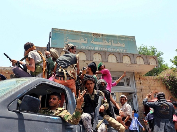 Tribal fighters from the popular resistance patrol outside the headquarters of Taiz Governorate following heavy clashes witht eh hotuhis and their allies in Taiz, Yemen, 15 August 2015. According to reports, tribal forces have captured much of Taiz, in central Yemen, after fierce clashes with Houthi fighters and forces loyal to ex-president Ali Abdullah Saleh. Following airstrikes and ground operations carried out by a Saudi led coalition forces opposing the Houthis have manged to capture ground beginning in Aden and spreading to the southern provinces of Lahj, al-Dalea and Abyan.