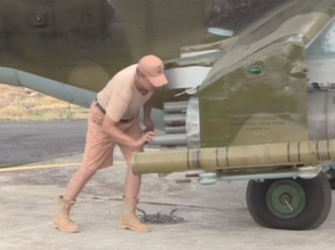 A still image taken from a October 6, 2015 footage, shows a technician servicing a Russian air force helicopter at Heymim air base near the Syrian port town of Latakia. The Syrian army and allied militia carried out ground attacks on insurgent positions in Syria on Wednesday backed by Russian air strikes, in what appeared to be their first major coordinated assault since Moscow intervened last week, a monitor said. REUTERS/RURTR via Reuters TVATTENTION EDITORS - THIS IMAGE HAS BEEN SUPPLIED BY A THIRD PARTY. IT IS DISTRIBUTED, EXACTLY AS RECEIVED BY REUTERS, AS A SERVICE TO CLIENTS. REUTERS IS UNABLE TO INDEPENDENTLY VERIFY THE AUTHENTICITY, CONTENT, LOCATION OR DATE OF THIS IMAGE. FOR EDITORIAL USE ONLY. NOT FOR SALE FOR MARKETING OR ADVERTISING CAMPAIGNS. NO SALES. NO ARCHIVES. RUSSIA OUT. NO COMMERCIAL OR EDITORIAL SALES IN RUSSIA