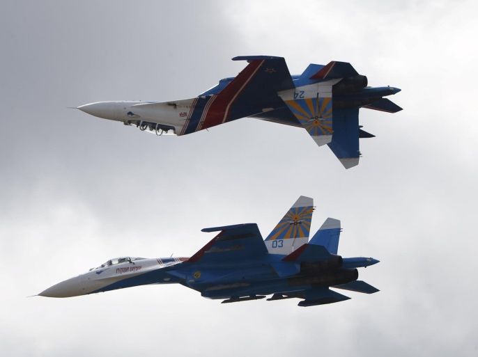 Sukhoi Su-27 jet fighters of the Russkiye Vityazi (Russian Knights) aerobatic team perform during the MAKS International Aviation and Space Salon in Zhukovsky outside Moscow, Russia, August 30, 2015. REUTERS/Maxim Zmeyev