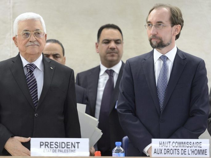 Palestinian President Mahmoud Abbas (L) and Zeid Ra'ad Al Hussein, United Nations High Commissioner for Human Rights (R) stand together during a meeting at the European headquarters of the United Nations, in Geneva, Switzerland, 28 October 2015. Others are not identified. The Human Rights Council convenes a special meeting on the occasion of the visit of Mahmoud Abbas.