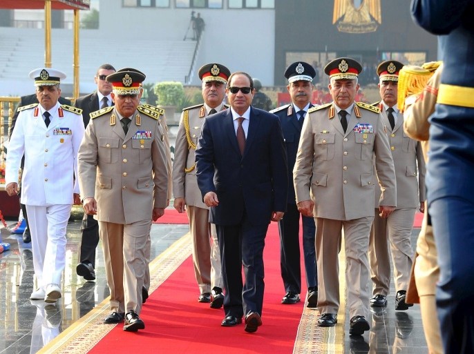 Egyptian President Abdel Fattah al-Sisi (C), Defense Minister Sedki Sobhi and Chief of Staff Mahmoud Hegazy visit the Unknown Soldier Memorial, in commemoration of the 1973 October War, in Cairo, Egypt, October 4, 2015. REUTERS/The Egyptian Presidency/Handout via Reuters. ATTENTION EDITORS - THIS IMAGE WAS PROVIDED BY A THIRD PARTY. REUTERS IS UNABLE TO INDEPENDENTLY VERIFY THE AUTHENTICITY, CONTENT, LOCATION OR DATE OF THIS IMAGE. IT IS DISTRIBUTED EXACTLY AS RECEIVED BY REUTERS, AS A SERVICE TO CLIENTS. FOR EDITORIAL USE ONLY. NOT FOR SALE FOR MARKETING OR ADVERTISING CAMPAIGNS. NO SALES.