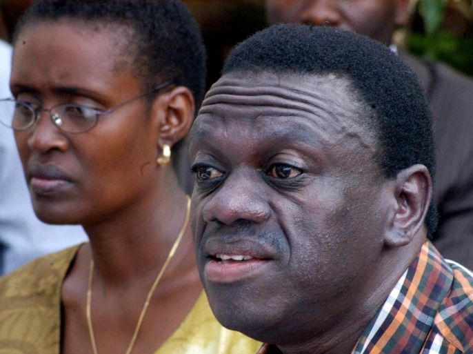 FILE-- In this Tuesday Jan. 3, 2006 file photo, Uganda's main opposition leader Kizza Besigye, right, and his wife, Winnie Byanyima, left, address a news conference in Kampala, Uganda. Uganda's long-serving president on Friday, July 31, 2015 declared his bid for re-election in 2016, saying the country needs him to stick around to continue its economic development. He will face a challenge from Kizza Besigye, who is widely expected to become the leader of a proposed united opposition (AP Photo, file)