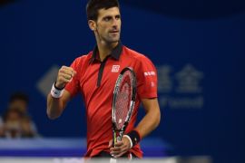 WH2717 - Beijing, -, CHINA : Novak Djokovic of Serbia celebrates after beating Rafael Nadal of Spain in the men's singles final at the China Open tennis tournament in Beijing on October 11, 2015. AFP PHOTO / WANG ZHAO