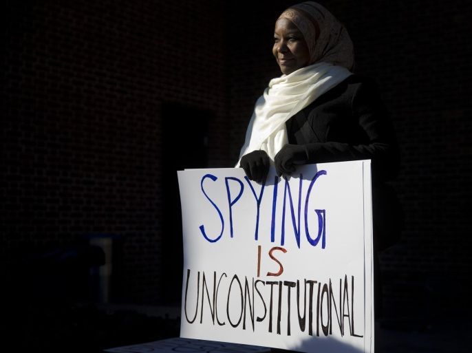 FILE - In this Jan. 13, 2015 file photo, Kameelah Rashad demonstrates outside the U.S. Courthouse in Philadelphia. A federal appeals court on Tuesday, Oct. 13, 2015, reinstated a lawsuit challenging the New York Police Department's surveillance of Muslim groups in New Jersey after the Sept. 11 terrorist attacks, saying any resulting harm came from the city's tactics, not the media's reporting of them.(AP Photo/Matt Rourke, File)