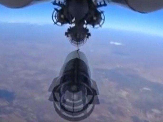 A frame grab taken from footage from a camera under a plane, released by Russia's Defence Ministry on October 5, 2015, shows a Russian military jet dropping bombs during airstrikes carried out by the country's air force near Idlib in Syria. Footage released October 5, 2015. REUTERS/Ministry of Defence of the Russian Federation/Handout via Reuters ATTENTION EDITORS - FOR EDITORIAL USE ONLY. NOT FOR SALE FOR MARKETING OR ADVERTISING CAMPAIGNS. THIS IMAGE HAS BEEN SUPPLIED BY A THIRD PARTY. IT IS DISTRIBUTED, EXACTLY AS RECEIVED BY REUTERS, AS A SERVICE TO CLIENTS. REUTERS IS UNABLE TO INDEPENDENTLY VERIFY THE AUTHENTICITY, CONTENT, LOCATION OR DATE OF THIS IMAGE. FOR EDITORIAL USE ONLY. NO SALES.