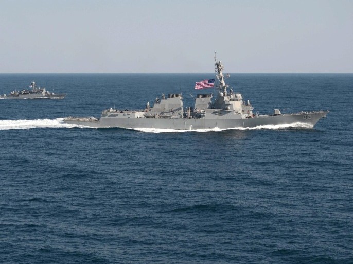 A handout picture released by the US Navy dated 12 March 2015 of the guided-missile destroyer USS Lassen (R) in formation with the South Korean patrol craft Sokcho during the Foal Eagle 2015 exercise in waters to the east of the Korean Peninsula. The destroyer USS Lassen sailed within 12 nautical miles of Subi Reef in the Spratly archipelago, one of the areas where Beijing has allegedly been building artificial islands, according to media reports on 27 October 2015. EPA/MC1 MARTIN WRIGHT / US NAVY / HANDOUT