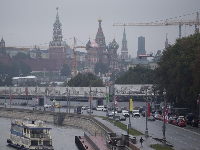 The St. Basil Cathedral, center, and the Kremlin are seen under a rain during the city day celebration in Moscow, Russia, Saturday, Sept. 5, 2015. Moscow is 868 years old. (AP Photo/Pavel Golovkin)