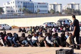 Some of the 220 refugees detained by the Libyan navy some 60 kilometers north of the capital, wait at the naval dock yard in Tripoli, Libya, 05 October 2015. According to reports Libyan naval forces have once again detained refugees attempting the dangerous Mediterranean crossing to Europe, as EU members continue to meet to formulate a solution to the some 500'000 refugees arriving so far in 2015 alone.