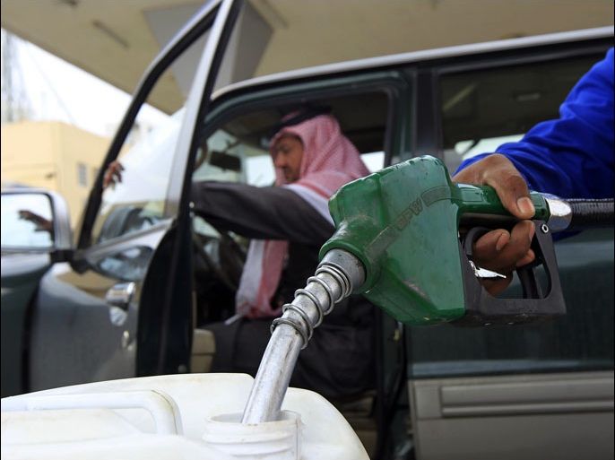 An employee fills a container with diesel at a gas station in Riyadh December 19, 2012. Saudi Arabia could as early as next year do something it has resisted for decades: raise what is currently the world's lowest price for natural gas, in order to reduce expensive subsidies and curb energy waste. A price hike would be an important economic shift for the country but a difficult one, as it would risk hurting the competitiveness of industries such as petrochemicals. To match Analysis SAUDI-GAS/PRICE REUTERS/Fahad Shadeed (SAUDI ARABIA - Tags: ENERGY BUSINESS)