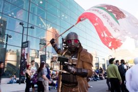 A costumed character from the video game "Fallout" attends New York Comic Con at the Javits Center on Sunday, Oct. 11, 2015, in New York. (Photo by Charles Sykes/Invision/AP)