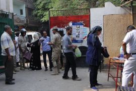 Members of the Egyptian security services check IDs as people arrive to vote in Egypt's Parliamentary elections, at a polling station in Giza, Egypt, 18 October 2015. Polling stations opened in 14 of Egypt's 27 governorates for the first round of Parliamentary elections, the country's first since the army removed President Mohammed Morsi from power June 2013.