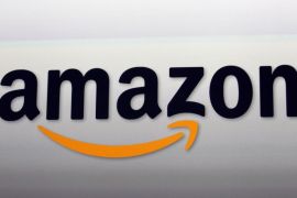 This Sept. 6, 2012 photo shows an Amazon logo at the introduction of the new Amazon Kindle Fire HD and Kindle Paperwhite personal devices, in Santa Monica, Calif. Amazon will report earnings Thursday April 23, 2015. (AP Photo/Reed Saxon)