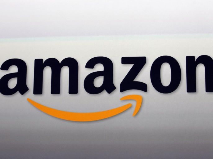 This Sept. 6, 2012 photo shows an Amazon logo at the introduction of the new Amazon Kindle Fire HD and Kindle Paperwhite personal devices, in Santa Monica, Calif. Amazon will report earnings Thursday April 23, 2015. (AP Photo/Reed Saxon)
