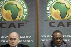 FILE - In this Feb. 10, 2012 file photo Confederation of African Football President Issa Hayatou, right, speaks as FIFA President Sepp Blatter, left, looks on during a joint press conference in Libreville, Gabon. FIFA said Thursday, Oct. 8, 2015 that African soccer leader Isaa Hayatou will serve as acting president. (AP Photo/Themba Hadebe, file)