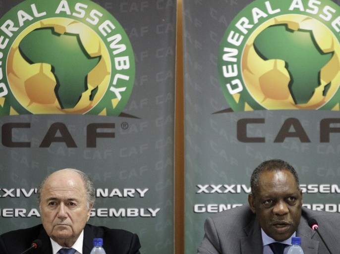 FILE - In this Feb. 10, 2012 file photo Confederation of African Football President Issa Hayatou, right, speaks as FIFA President Sepp Blatter, left, looks on during a joint press conference in Libreville, Gabon. FIFA said Thursday, Oct. 8, 2015 that African soccer leader Isaa Hayatou will serve as acting president. (AP Photo/Themba Hadebe, file)