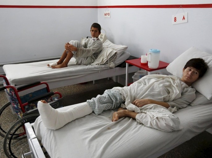 Wounded Afghan boys, who survived a U.S. air strike on a Medecins Sans Frontieres (MSF) hospital in Kunduz, receive treatment at the Emergency Hospital in Kabul October 8, 2015. The U.S. air strike in Afghanistan that killed at least 22 patients and staff at the Medecins Sans Frontieres hospital wasn't the first time the escalating war has affected an aid-run medical facility. There have even been instances since. Foreign aid workers and Afghan colleagues shaken by the weekend tragedy in Kunduz, one of the worst incidents of its kind in the 14-year war, say increased violence around the country makes it harder to provide basic services in a country where NGOs help provide the vast majority of healthcare. To match Insight AFGHANISTAN-HEALTH/VIOLENCE REUTERS/Mohammad Ismail