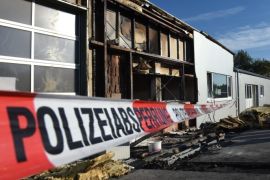 A police barrier tape seals off an empty warehouse, which burnt earlier on Tuesday morning in Oberteuringen, Germany, 29 September 2015. The warehouse was going to be turned into a new refugee shelter. The police assumes it was an arson attack.