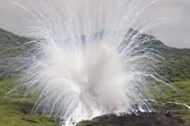 A white phosphorous shell explodes on target during the Lien Yung annual joint forces exercises in Pingtung County, southern Taiwan, June 7, 2012. REUTERS/Pichi Chuang (TAIWAN - Tags: MILITARY)