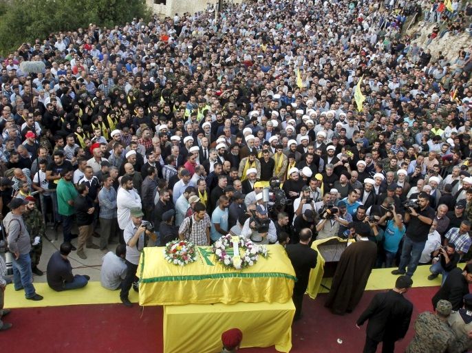 Lebanon's Hezbollah members, supporters and relatives attend the funeral of Hassan al-Haj, one of Hezbollah's top commanders who was killed fighting alongside Syrian army forces in Idlib province, in his hometown of al-Luwaizeh, southern Lebanon October 12, 2015. Lebanon's Hezbollah on Monday buried a commander described as the group's most important military figure to be killed in the four-year-long Syrian war. Hassan al-Haj was killed in Idlib province in northwestern Syria, where the Iranian-backed group is fighting Syrian rebels in an offensive in support of President Bashar al-Assad and backed by Russian air strikes. REUTERS/Ali Hashisho