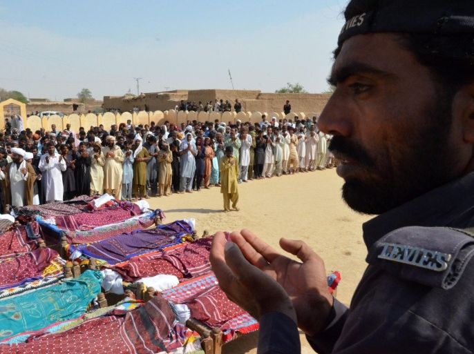 Relatives and people attend the funeral ceremony of victims who were killed in suicide bomb attack, in Bhag area of Naseerabad, Balochistan province, Pakistan, 23 October 2015. At least 10 people were killed when a male bomber clad in a female veil entered the mosque by deceiving the guards at the gate in the remote Sibi district, provincial home minister Sarfaraz Bugti said. The attack came ahead of the Ashura festival on 24 October, observed by Shiites to commemorate the martyrdom of Hussein Ibne Ali, the grandson of Prophet Mohammed.