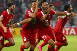 Kwon Kyung-Won (C) of UAE's Al-Ahli celebrates after scoring a third goal against Saudi's Al-Hilal during their AFC Champions League semi final football match on October 20, 2015 in Dubai. AFP PHOTO / MARWAN NAAMANI