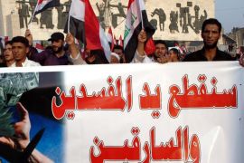 Iraqis carry a banner reading in Arabic 'We will cut off the hands of thieves and the corrupt' during a demonstration in Tahrir square, central Baghdad, Iraq, 02 October 2015. According to media reports thousands of Iraqis continue to hold protests in Baghdad and other provinces demanding implementation of wide reforms offered by Prime Minister Haider al-Abadi, aimed at reforming the political system in attempts to eliminate widespread graft, and improve public services.