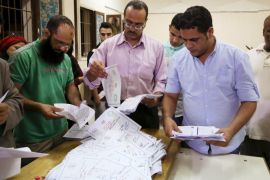Employees count ballots after polls closed in the first phase of parliamentary elections at a voting center in Dokki, Giza governorate, Egypt, October 19, 2015. As the first round of Egypt's parliamentary elections came to a close on Monday night, turnout appeared weak for the second consecutive day, highlighting growing disillusionment since the army seized power in 2013. REUTERS/Asmaa Waguih