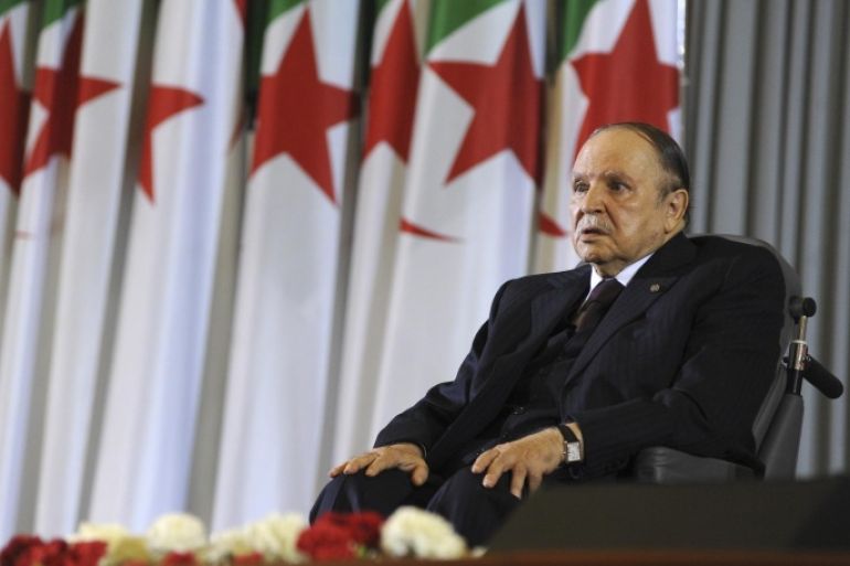 FILE - In this April 28, 2014 file photo, Algerian President Abdelaziz Bouteflika, sitting in a wheelchair, listens after taking the presidential oath in Algiers. Algeria is in the grips of political intrigue, as the president nears death and rumors of coup attempts swirl. Now, the unprecedented firing of three top generals is generating fear that a power struggle within the regime will break into the open - unleashing a new cycle of the bloodshed that plagued the country in the 1990s. (AP Photo/Sidali Djarboub, File)