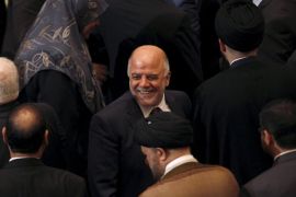 Iraq's new premier Haider al-Abadi (C) attends the parliament session to submit his government at the parliament headquarters in Baghdad, Iraq in this September 8, 2014 file photo. To match Special Report IRAQ-ABADI/ REUTERS/Ahmed Saad/Files
