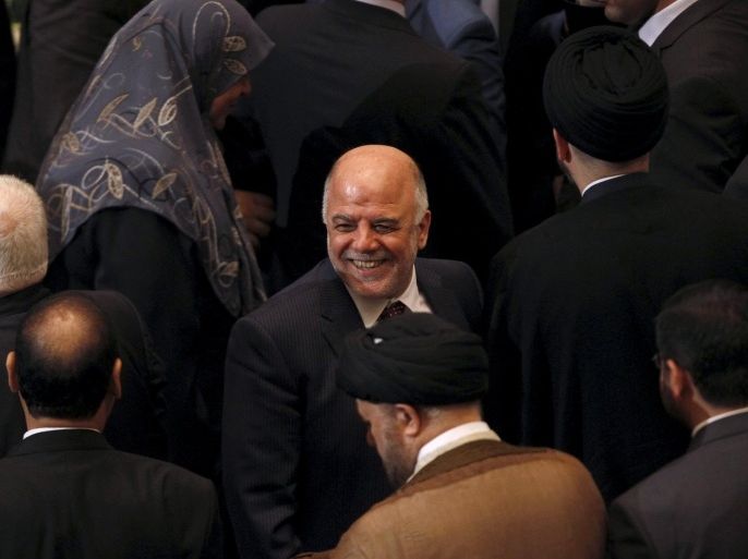 Iraq's new premier Haider al-Abadi (C) attends the parliament session to submit his government at the parliament headquarters in Baghdad, Iraq in this September 8, 2014 file photo. To match Special Report IRAQ-ABADI/ REUTERS/Ahmed Saad/Files