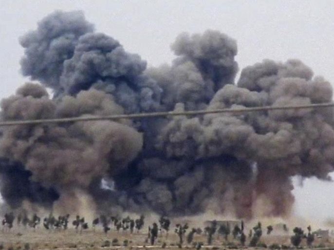 FILE - In this Thursday, Oct. 1, 2015 file image made from video provided by Hadi Al-Abdallah, which has been verified and is consistent with other AP reporting, smoke rises after airstrikes in Kafr Nabel of the Idlib province, western Syria. Russian jets carried out a second day of airstrikes in Syria Thursday, but there were conflicting claims about whether they were targeting Islamic State and al-Qaeda militants or trying to shore up the defenses of President Bashar Assad. (Hadi Al-Abdallah via AP video, File)