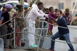 Migrants disembark from British vessel HMS Enterprise in the Sicilian harbour of Catania, Italy, October 6, 2015. The Italian coastguard said on Tuesday some 1830 migrants have been rescued from the Mediterranean sea in a twenty-four hour period. Six different rescue operations took place on Monday with the coastguard reinforced by German, Norwegian, British and Irish vessels. REUTERS/Antonio Parrinello