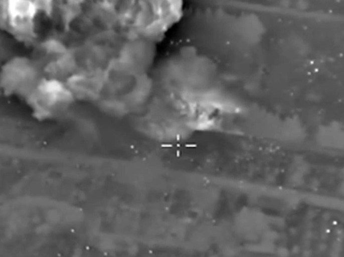 A handout frame grab taken from a video footage made available on the official website of the Russian Defence Ministry on 14 October 2015 shows an aerial view of smoke rising after airstrike carried out by Russian Su-34 bomber against what Russia says Islamic State (ISIS or IS) command centre near Aleppo, Syria. Reports on 13 October said the Russian Defence Ministry conducted airstrikes within the last 24 hours on 86 targets in Syria, including command centers, weapons and ammunition stores, military equipment, suspected explosives factories, field camps and militant bases.  EPA/RUSSIAN DEFENCE MINISTRY PRESS SERVICE/HANDOUT