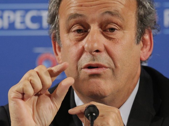 FILE - In this Feb 22, 2014 file photo UEFA President Michel Platini gestures during a press conference, one day prior to the UEFA EURO 2016 qualifying draw at the Acropolis Convention Centre in Nice, southeastern France. On Thursday, Oct. 8, 2015 FIFA provisionally banned President Sepp Blatter and UEFA President Michel Platini for 90 days. (AP Photo/Lionel Cironneau)