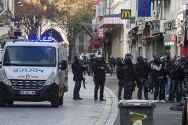 In this photo released Friday Nov. 20, 2015, by the French Interior Ministry, showing Police security forces during the raid in Saint-Denis region of Paris, France, on Wednesday Nov. 18 2015. French security forces stormed a building in the early hours of Wednesday Nov. 18, in Saint Denis, Paris, where the mastermind of the Nov. 13, Paris attacks Abdelhamid Abaaoud, was believed to be hiding, resulting in a shoot-out.(Jerome Groisard / Ministere de l'Interieur – Dicom via AP)