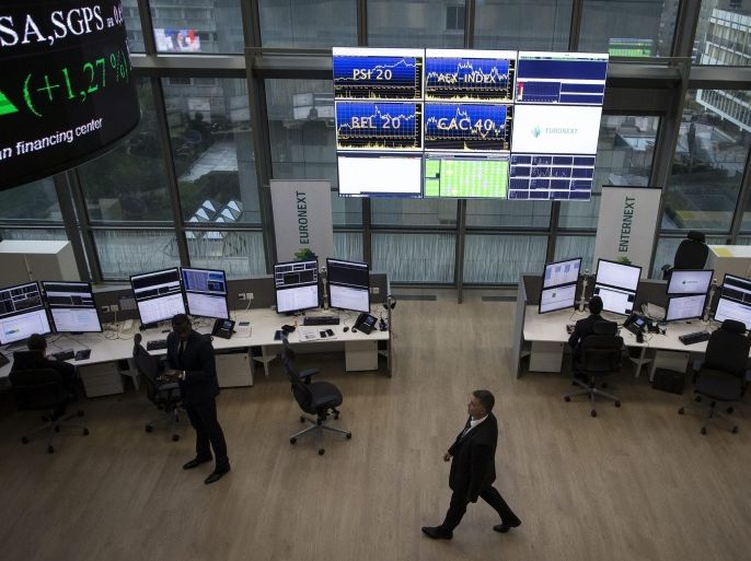 Analysts work in the market services surveillance center of the French stock market operator Euronext, in the business and financial district La Defense, in Courbevoie, near Paris, France, 30 October 2015. Euronext is a Amsterdam-based pan-European stock market operating the exchange markets in Amsterdam, Brussels, Lisbon and Paris.