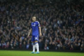 Chelsea's captain John Terry stands in the rain during the English Premier League soccer match between West Ham and Chelsea at Upton Park stadium in London, Saturday, Oct. 24, 2015. (AP Photo/Matt Dunham)
