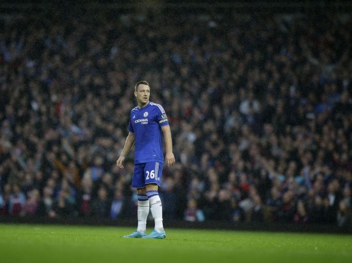 Chelsea's captain John Terry stands in the rain during the English Premier League soccer match between West Ham and Chelsea at Upton Park stadium in London, Saturday, Oct. 24, 2015. (AP Photo/Matt Dunham)