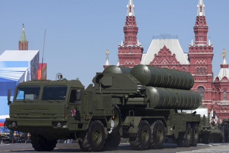 FILE - In this Tuesday May 7, 2013 file photo, Russian S-400 air defense missile systems make their way through Red Square during a rehearsal for the Victory Day military parade in Moscow, Russia. In a move raising the potential threat of a Russia-NATO conflict, Russia said Wednesday Nov. 24, 2015 it will deploy long-range air defense missiles to its base in Syria and destroy any target that may threaten its warplanes following the downing of a Russian military jet by Turkey. (AP Photo/Alexander Zemlianichenko, File)