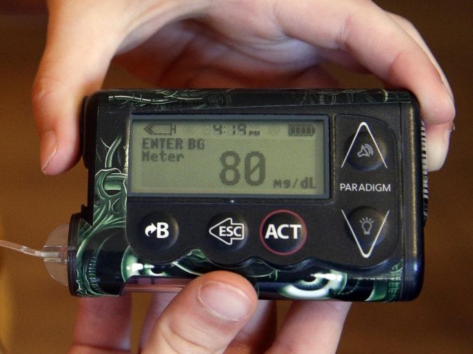 In this photo taken Wednesday, May 13, 2015, Weston Murphy, 5, who has Type 1 diabetes, checks his blood glucose meter at his home in Plainfield, Ill. In Type 1, the pancreas stops making insulin, a blood sugar-regulating hormone that helps the body convert sugar in food into energy. Treatment is lifetime replacement insulin, usually via injections or a small pump. In Type 2, the body can't make proper use of insulin. It can sometimes be treated with a healthy diet and exercise. (AP Photo/Nam Y. Huh)