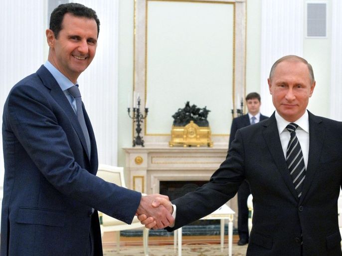 A picture made available on 21 October 2015 shows Russian President Vladimir Putin (R) shaking hands with Syrian President Bashar al-Assad during their meeting at the Kremlin in Moscow, Russia, 20 October 2015. Beleaguered Syrian President Bashar al-Assad travelled to Moscow for talks with his Russian counterpart Vladimir Putin, the Kremlin revealed on 21 October 2015. Assad and Putin discussed the situation in war-torn Syria on 20 October 2015 evening during the talks that had not been made public in advance, the Kremlin spokesman said. The talks dealt with the 'fight against terrorist extremist groups' and with Russian air support for attacks by Syrian troops on the ground. Russia has been carrying out airstrikes in Syria since the end of September. Moscow has declared the so-called Islamic State (IS or ISIS) as the main enemy, but Western nations have accused Moscow of attacking other groups opposed to the Assad regime. EPA/ALEXEY DRUZHINYN/RIA NOVOSTI/POOL ALTERNATIVE CROP